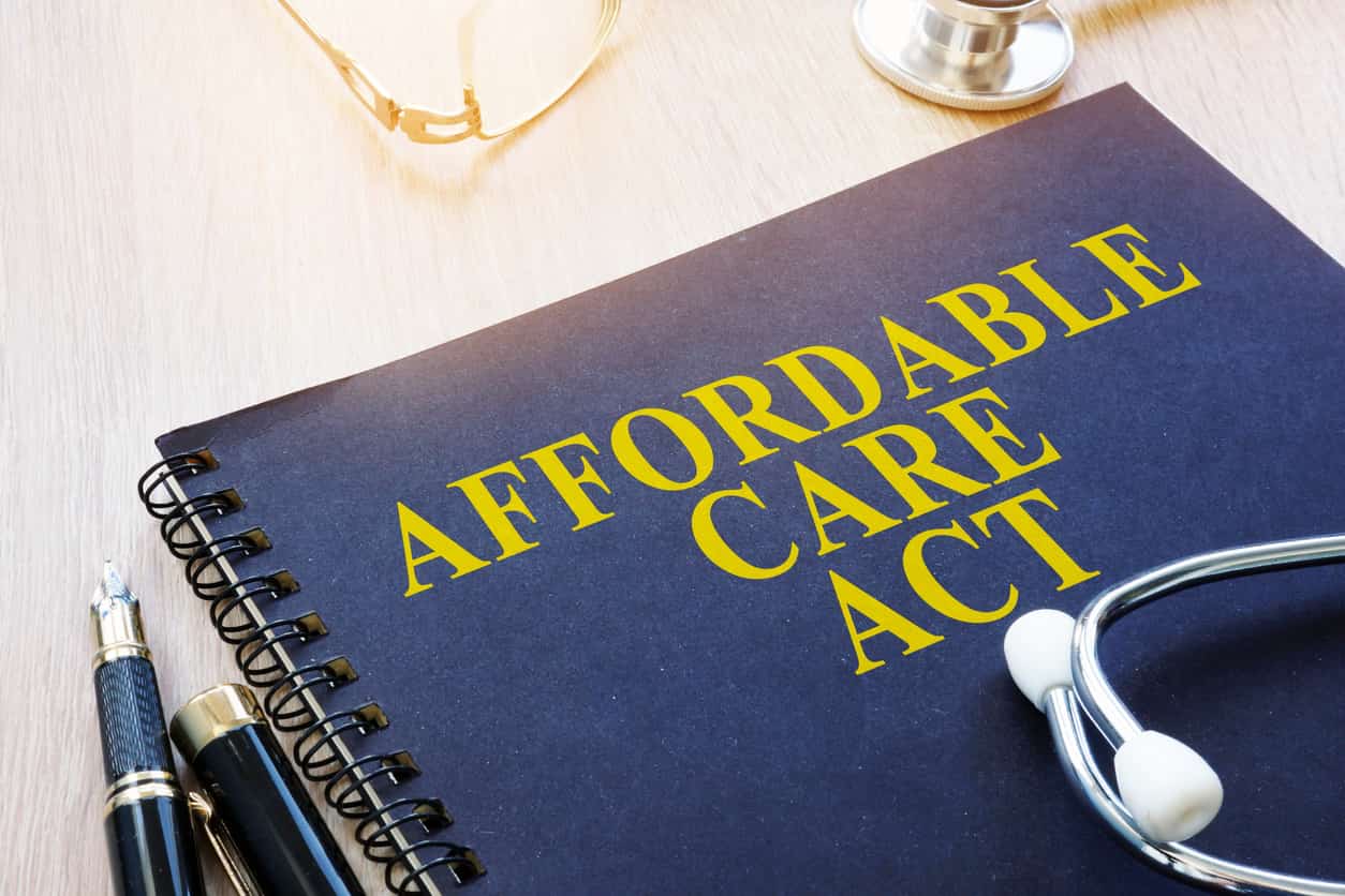 Affordable Care Act ACA and stethoscope on a table