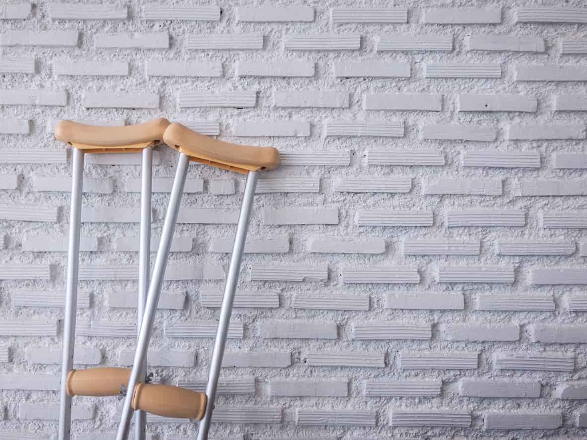 crutches leaning on wall